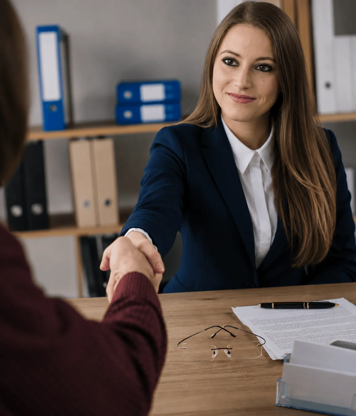 An attorney at Clifford Levin Attorneys reviewing and signing legal documents